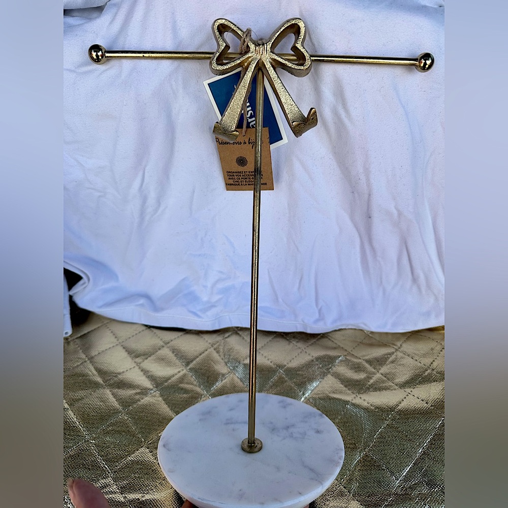 Gold Bow jewelry stand on Marble Base